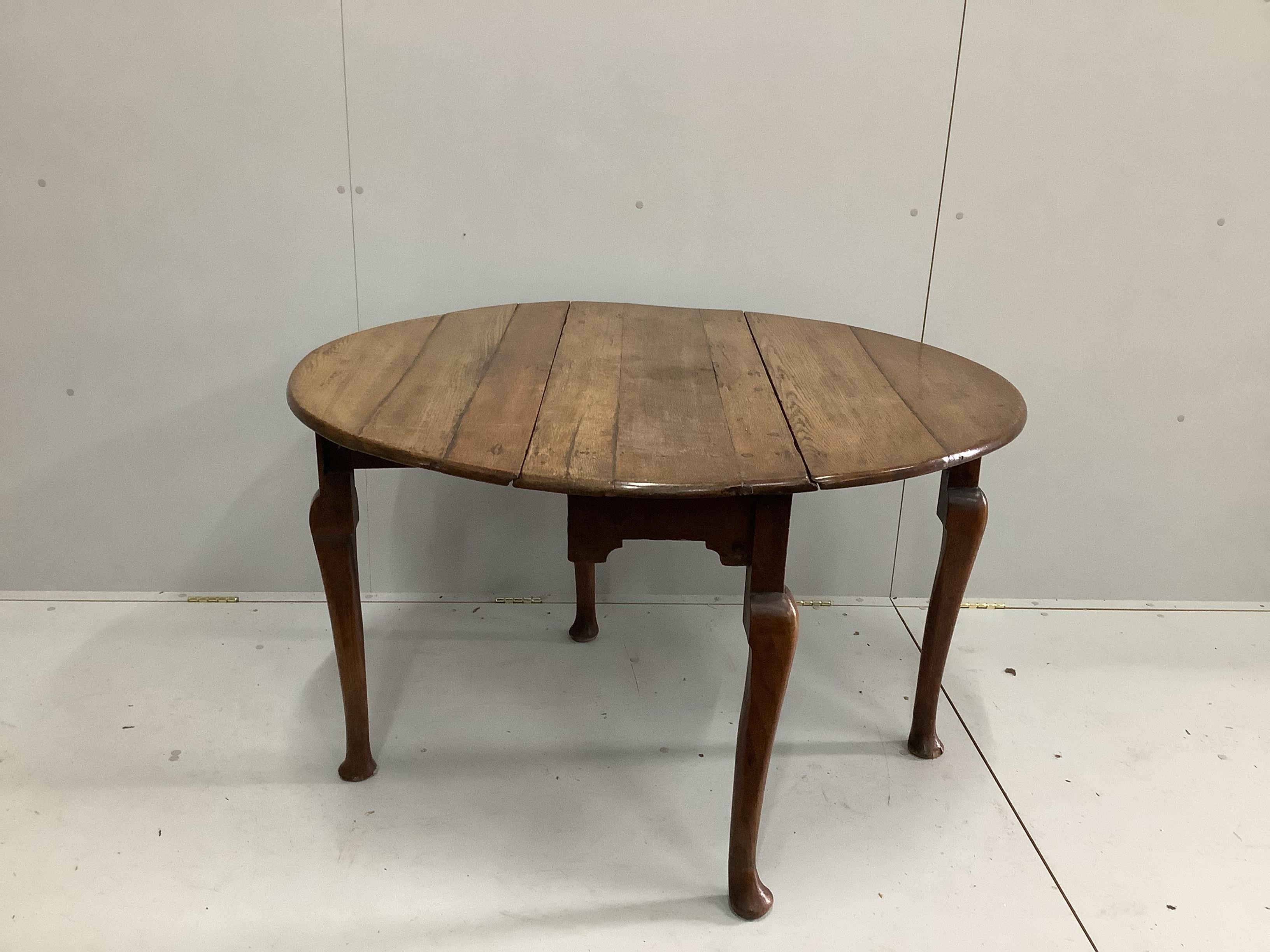 An 18th century provincial oak drop leaf pad foot table, width 104cm, depth 38cm, height 71cm